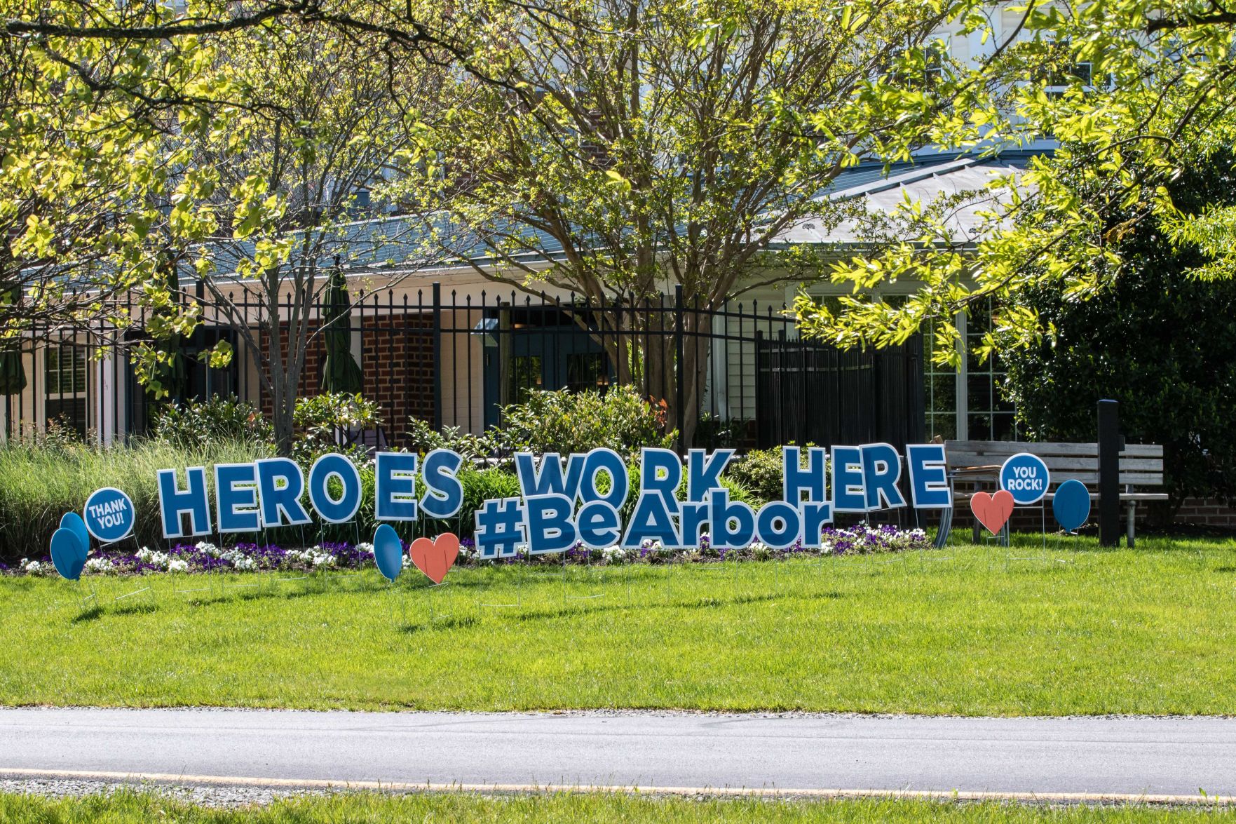 Arbor Terrace Sudley Manor workers sign 'heroes work here'